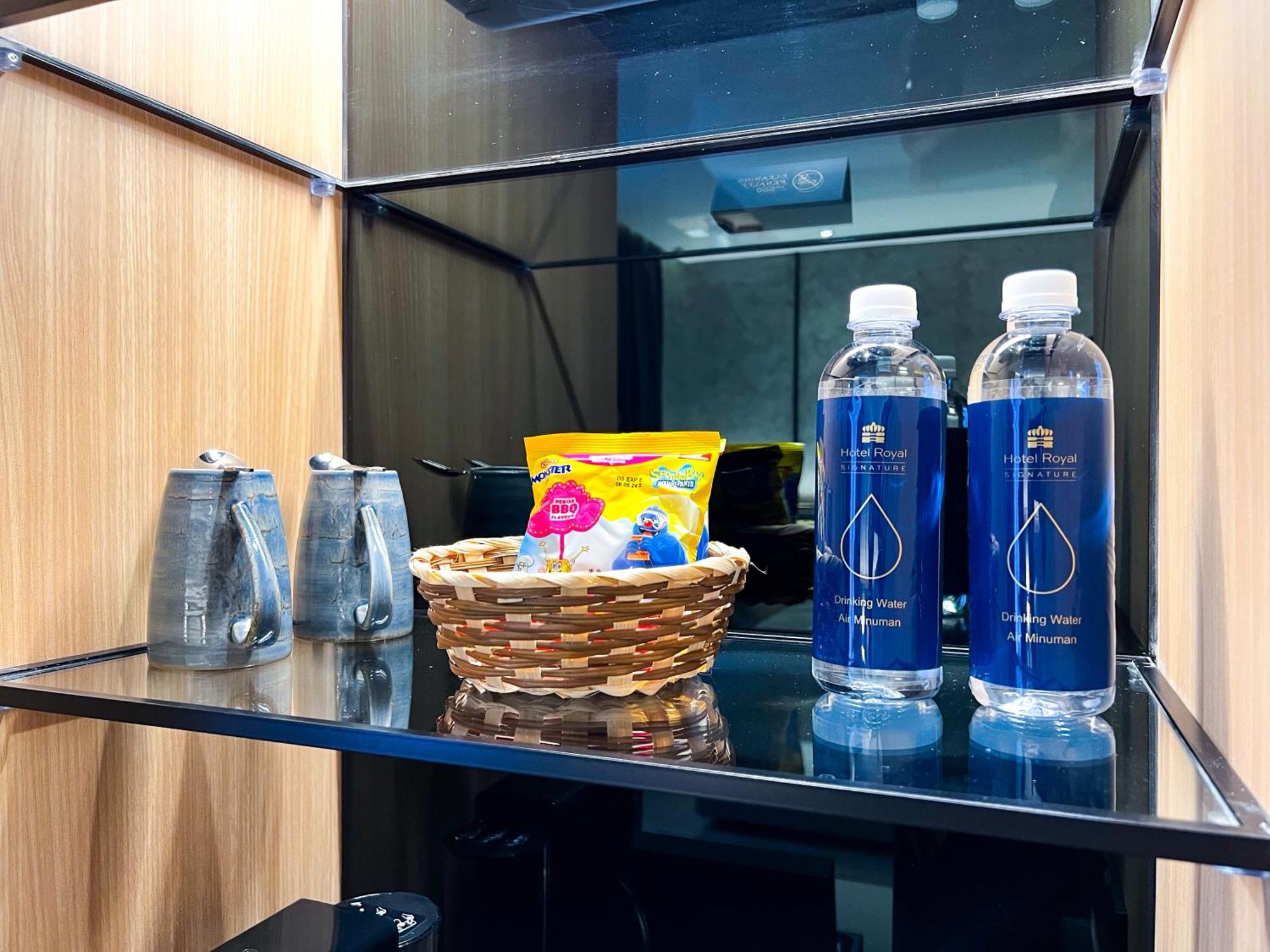 Hotel Royal Signature Kuala Lumpur Exterior photo Bottled water and snacks in a hotel room