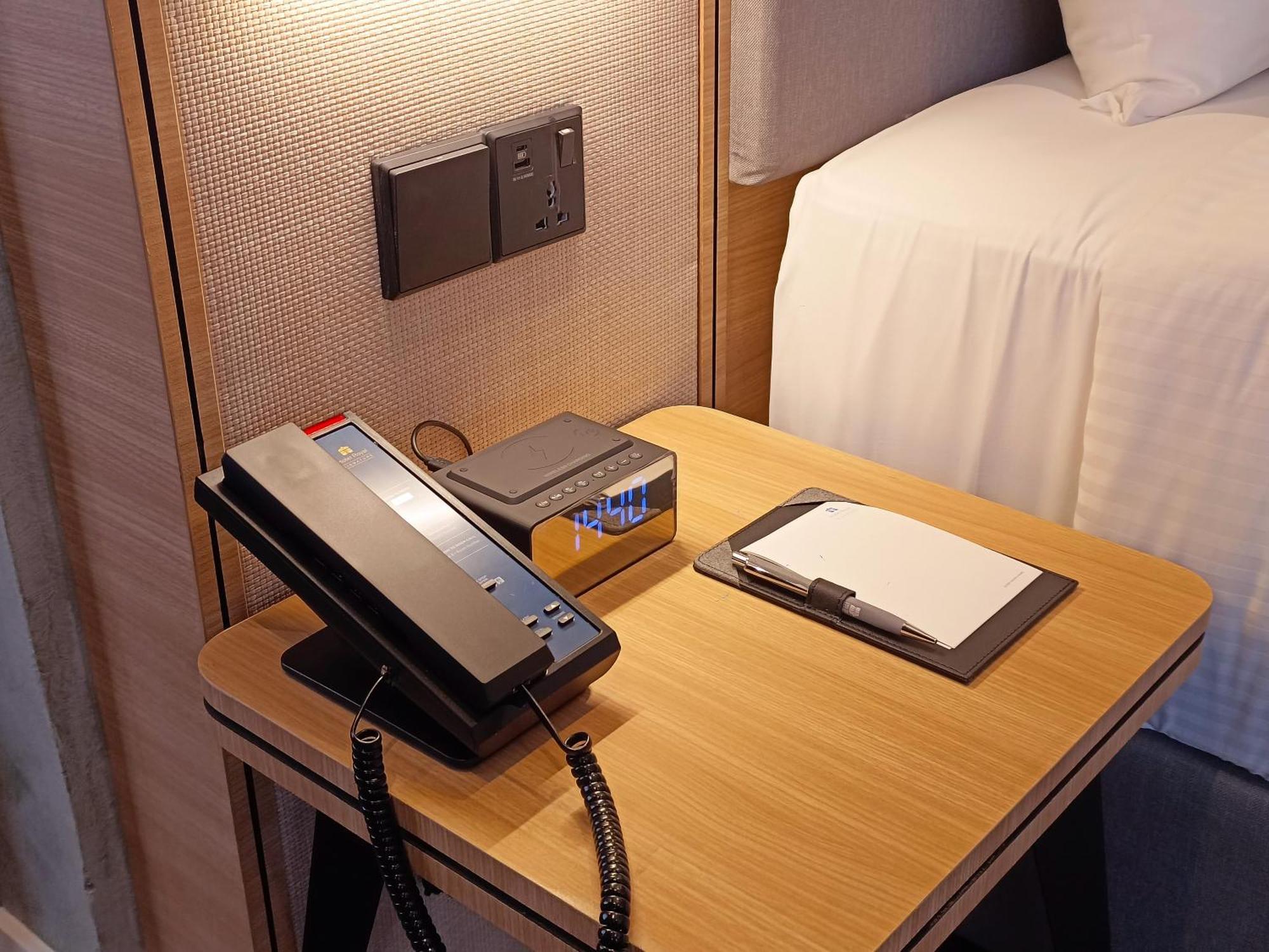 Hotel Royal Signature Kuala Lumpur Exterior photo A telephone in a hotel room